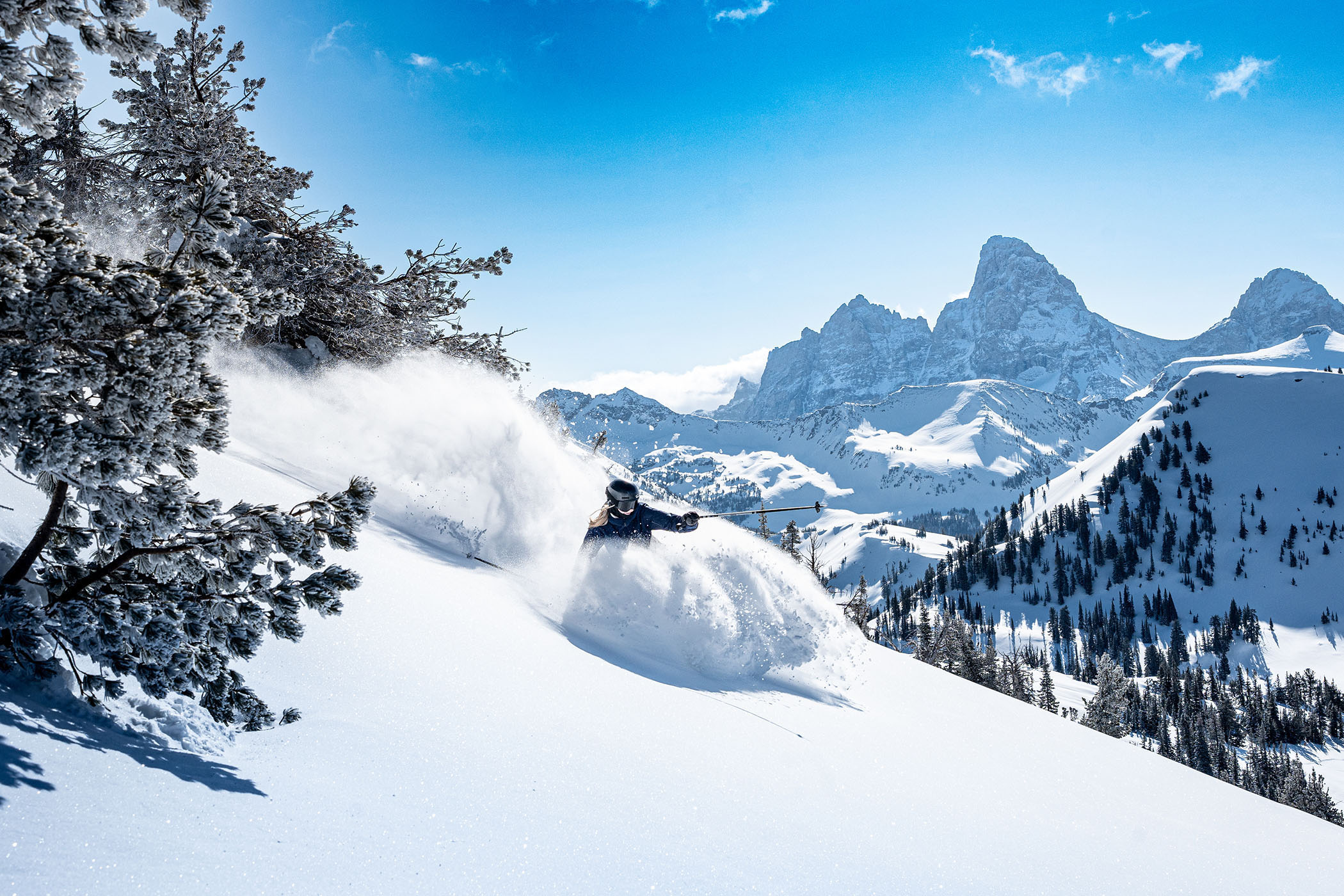 skier dives into fresh pow at Grand Targhee
