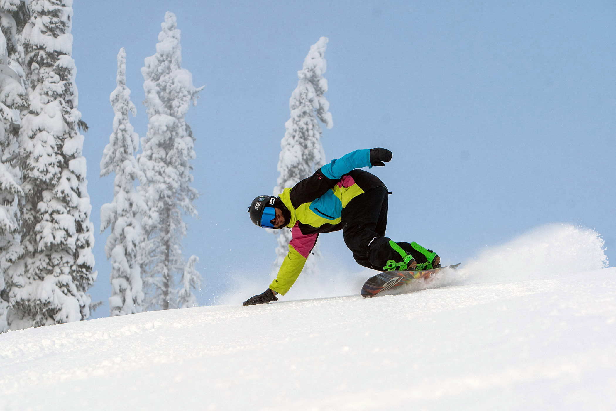 A snowboarder descends a groomer at Lookout Pass Ski & Recreation Area in North Idaho.